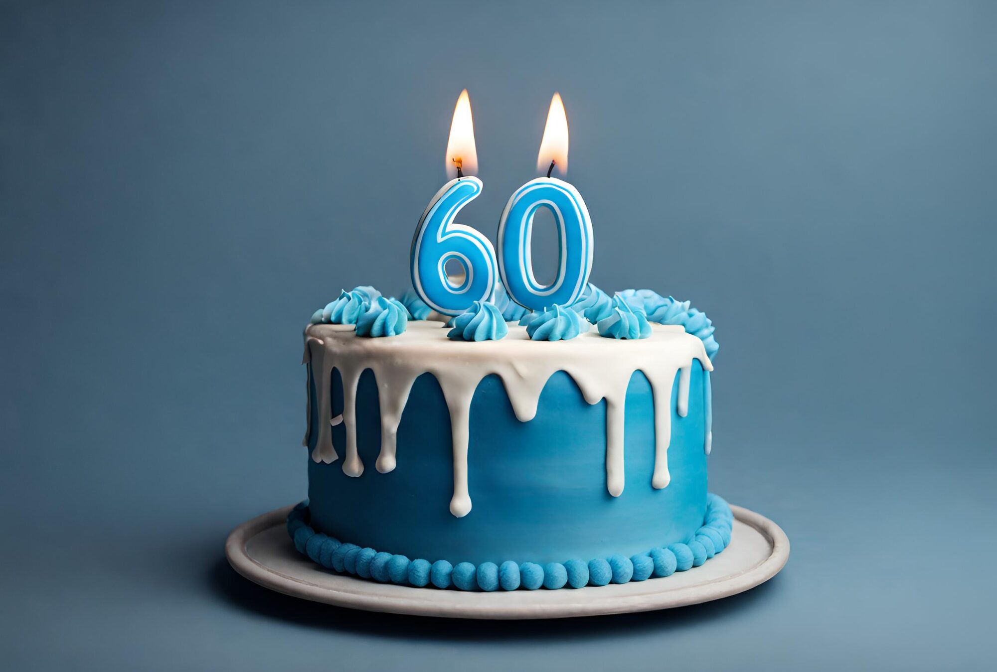 An AI generated image of a blue and white cake. There are lit candles in the shape of a six and a zero standing on the top