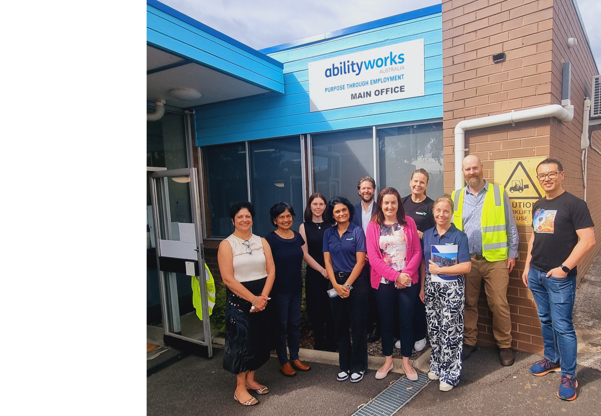 Ventia and Ability Works staff group together outside the Ability Works office.